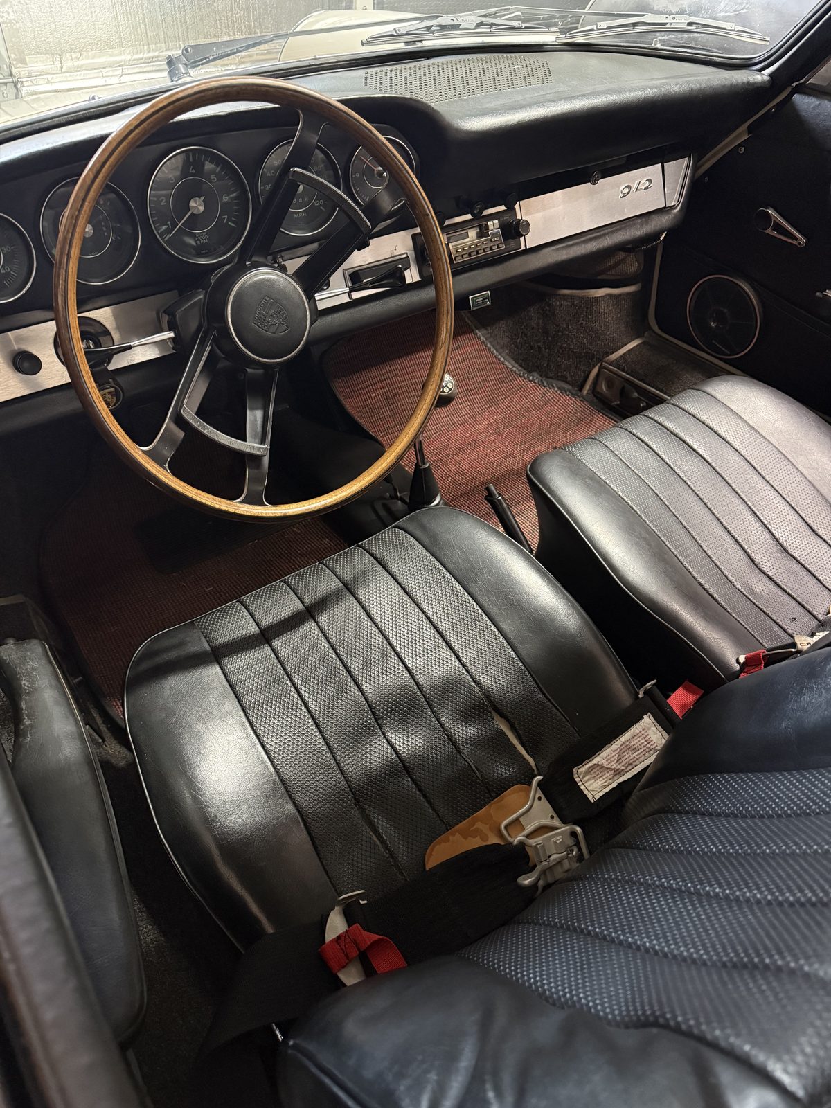 Interior showing the original wood and aluminum steering wheel
