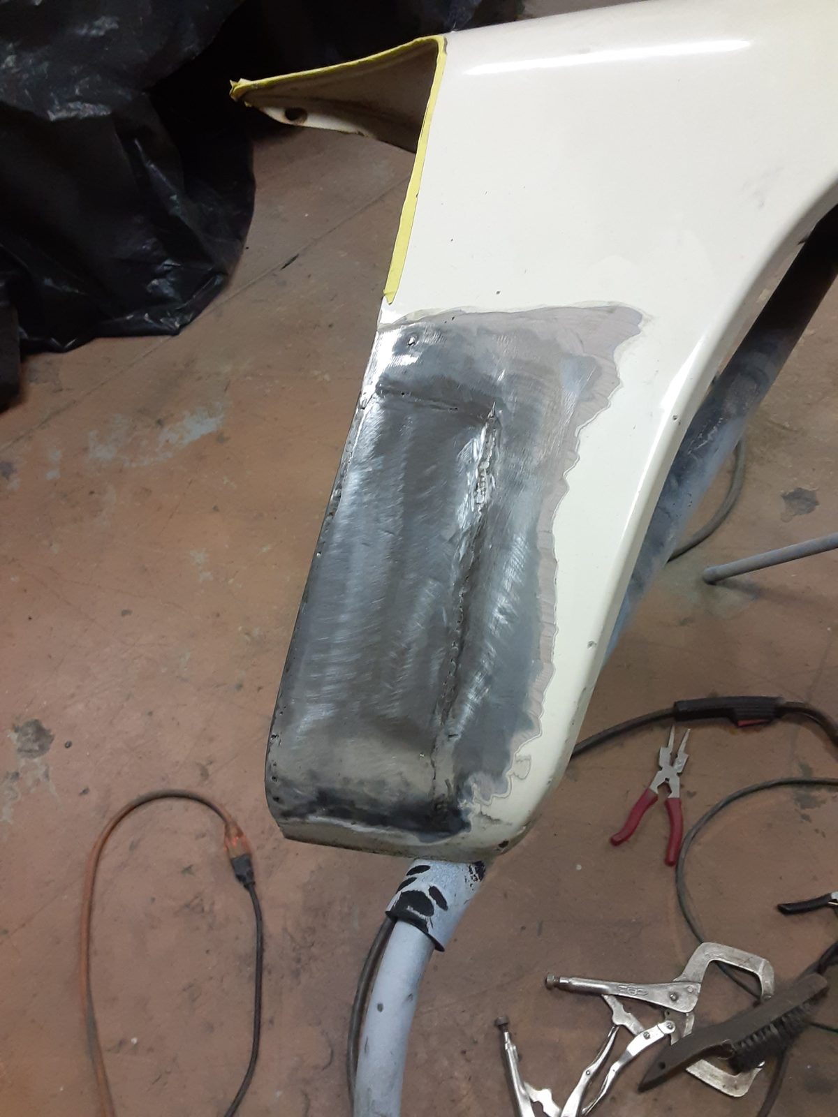 New metal welded into the repaired panel