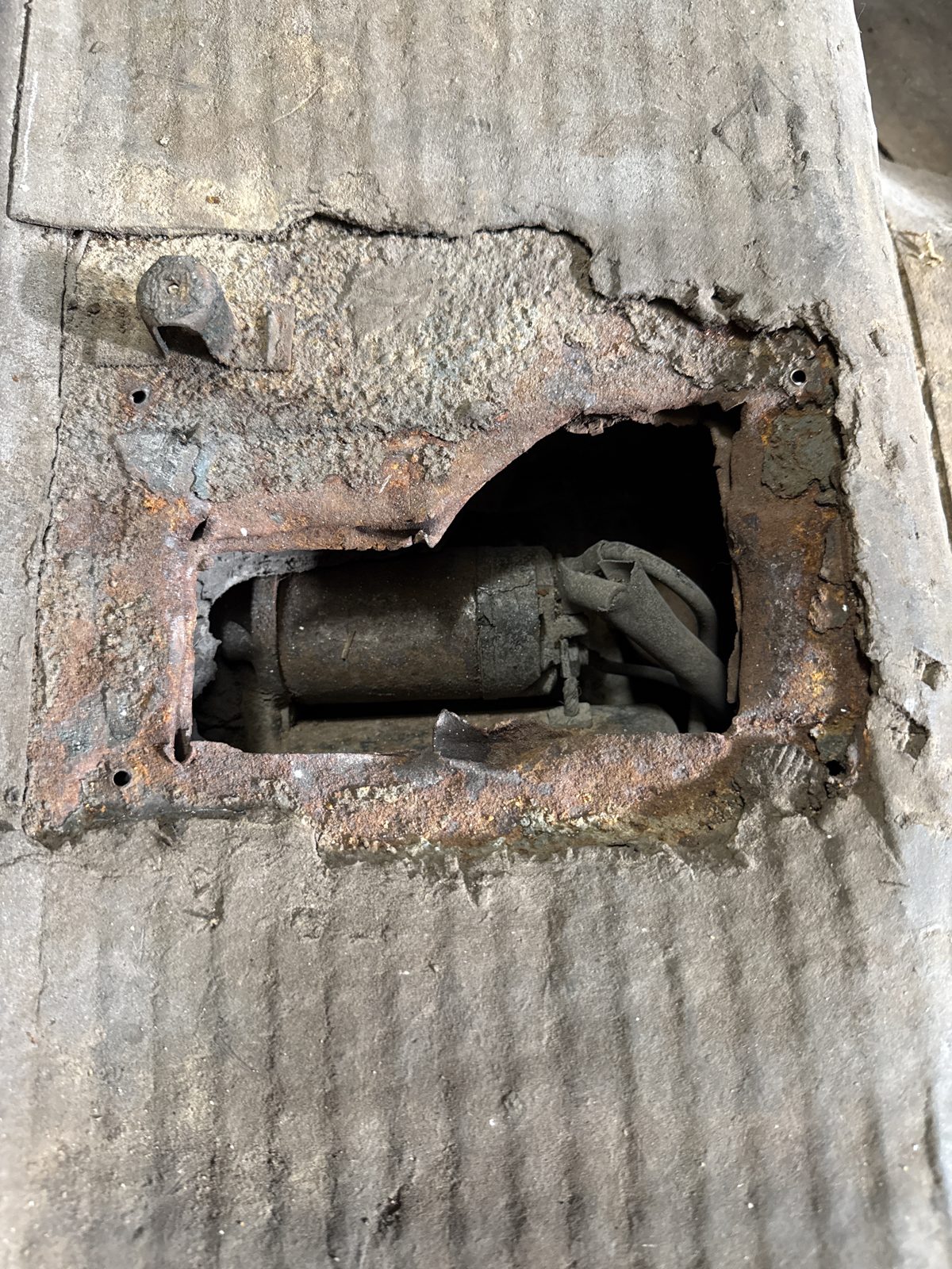 Rear cabin sheet metal cut open to route the generator into the cabin