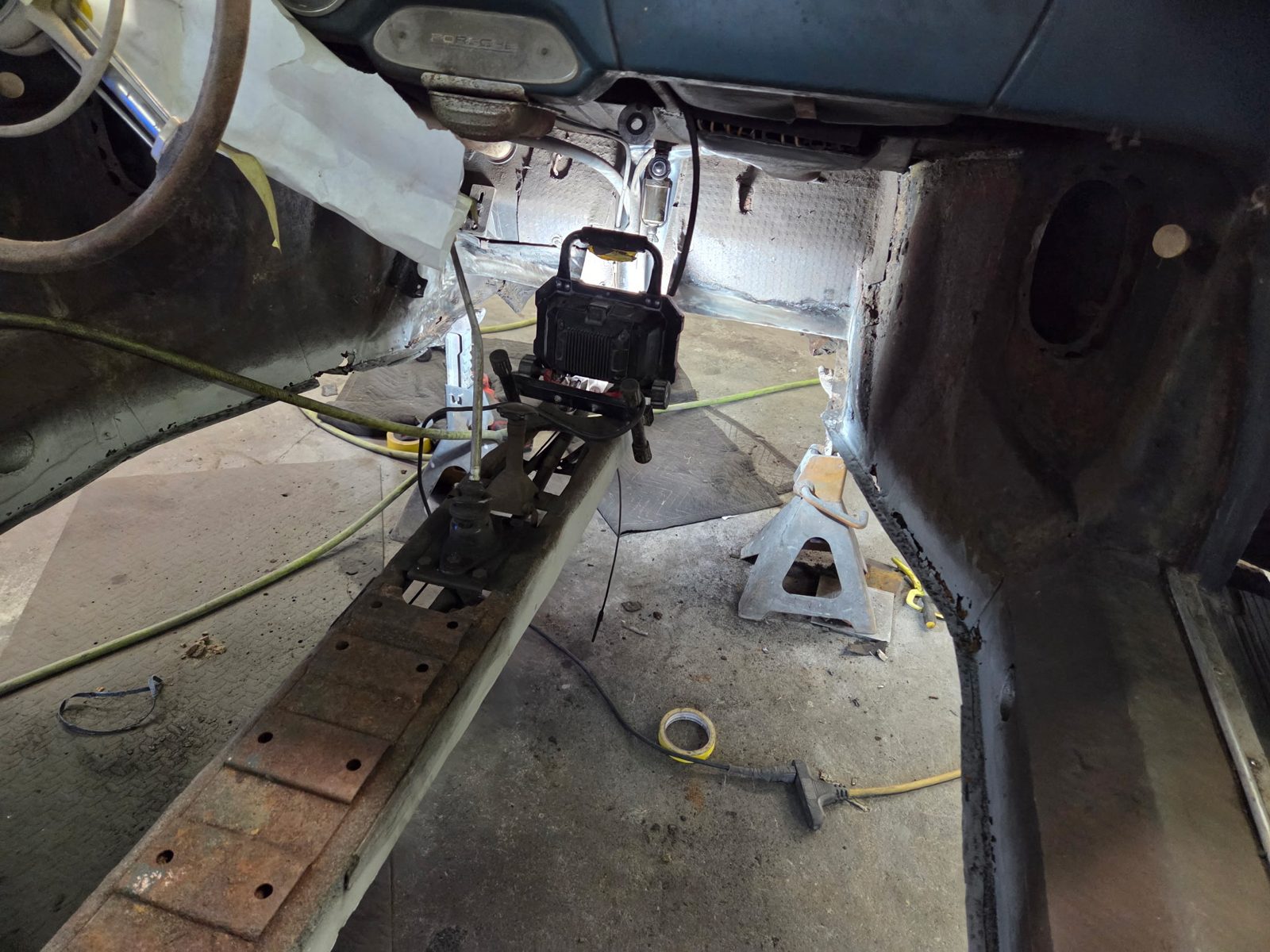 Interior with old floor removed, tunnel and longitudinals exposed