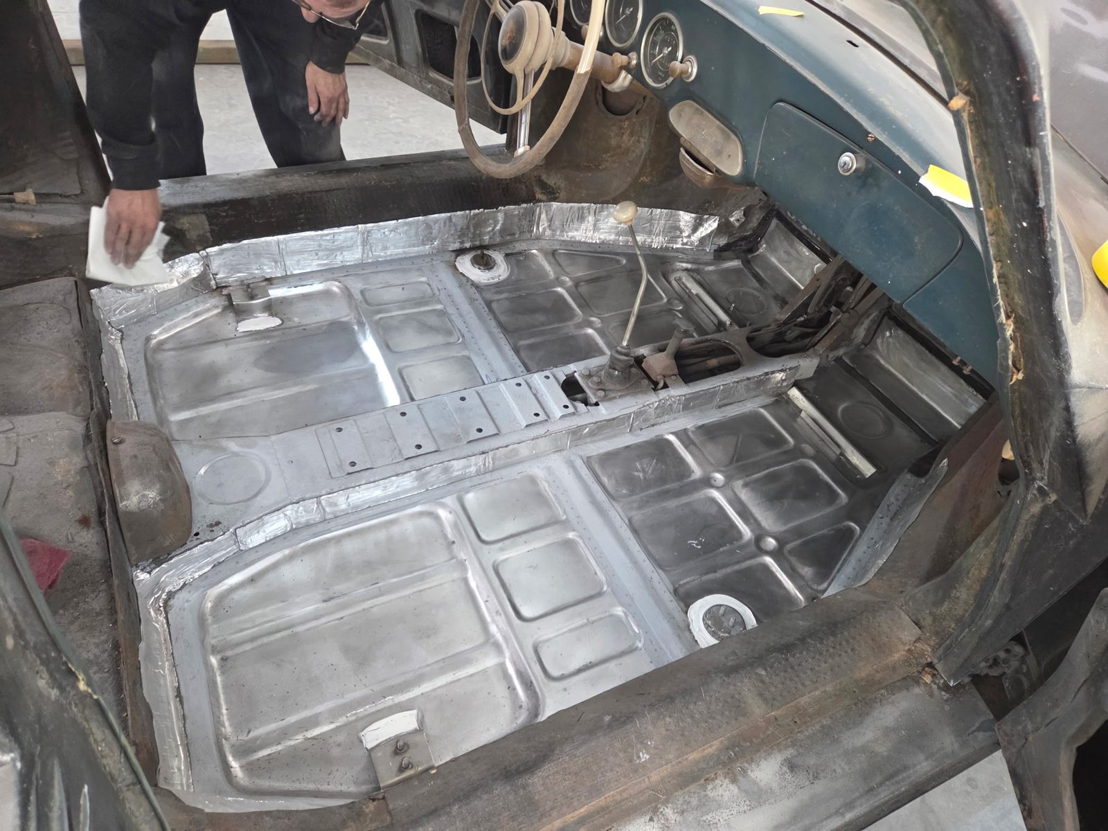 New floor pans fitted in the car, bare steel