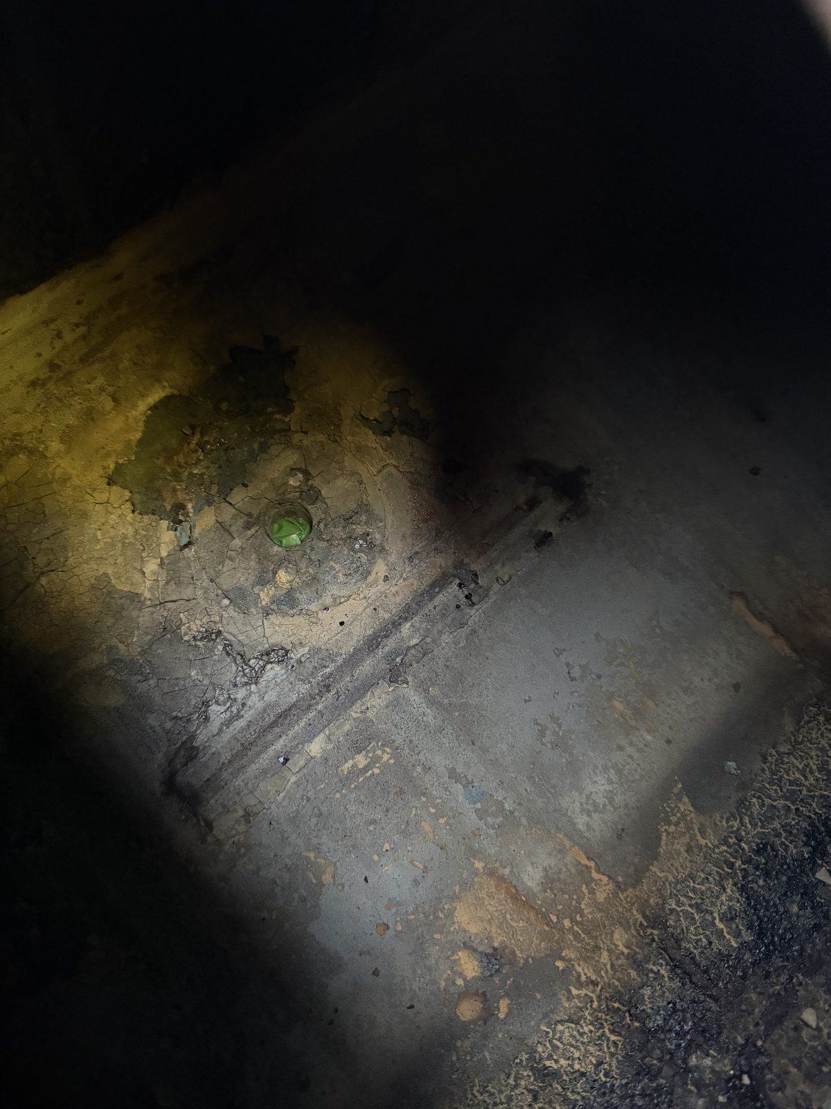 Corrosion in the compartment floor beneath where the tank sat