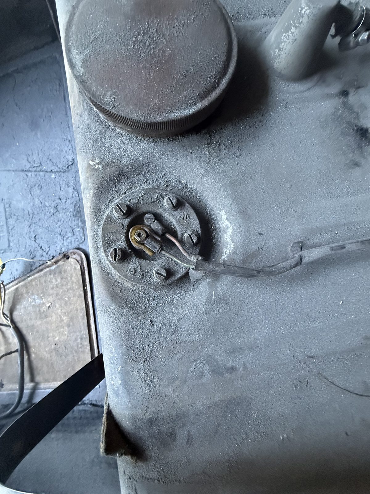 Top of the fuel tank showing filler neck and sender mounting